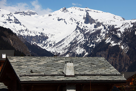 山中的白远足日落娱乐小屋高山太阳木头蓝色旅行建筑图片