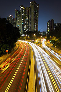 城市中的汽车小道辉光场景速度摩天大楼街道戏剧性运动景观车辆建筑图片