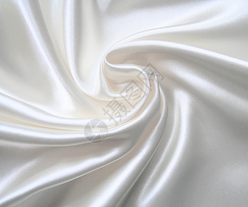 平滑优雅的白色丝绸投标折痕布料曲线银色材料新娘织物纺织品涟漪图片