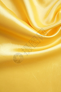 平滑优雅的金金丝绸黄色投标纺织品曲线涟漪折痕织物海浪丝绸材料图片