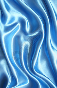 平滑优雅的蓝色丝绸曲线布料银色投标海浪纺织品织物材料折痕图片