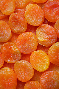 以干杏为背景橙子营养蔬菜葡萄干早餐种子小吃团体食物黄色图片