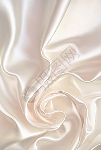平滑优雅的白色丝绸纺织品海浪折痕银色布料婚礼织物感性曲线材料图片
