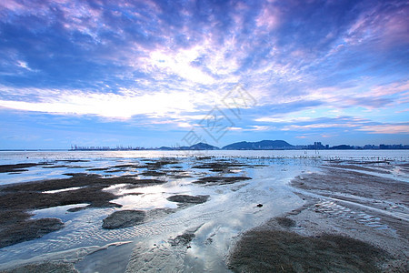 黄昏时 香港日落天气橙子日光气候阳光反射地平线天空海浪海滩图片