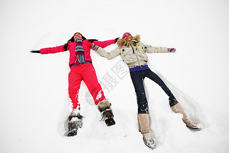 寒冬享受帽子幸福金发微笑女孩雪花闲暇思维活动图片