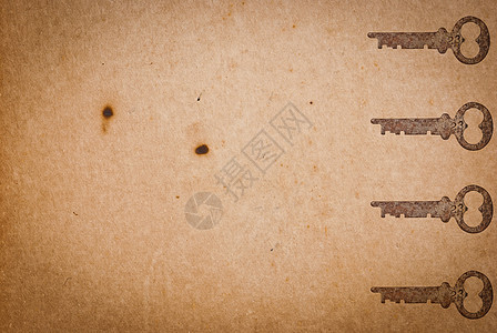 旧纸页背景的锈键木板棕色房子财产钥匙材料古董安全工具金属图片