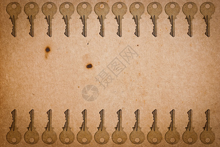 旧纸页背景的锈键安全木板金属工具材料钥匙棕色房子古董宏观图片