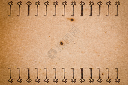 旧纸页背景的锈键古董金属安全钥匙木板财产材料棕色宏观工具图片