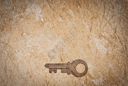 旧纸页背景的锈键房子财产钥匙棕色工具宏观材料金属古董木板图片