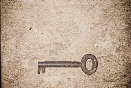旧纸页背景的锈键宏观钥匙材料木板房子工具财产金属棕色古董图片