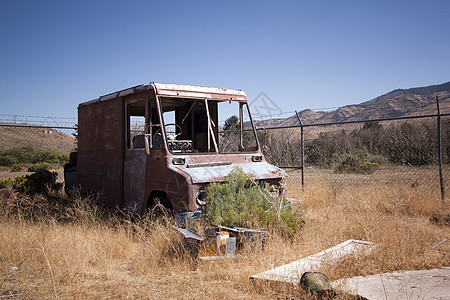 废弃的旧旧生锈卡车陆地田园热情艺术棕色风景太阳日落草原交通图片