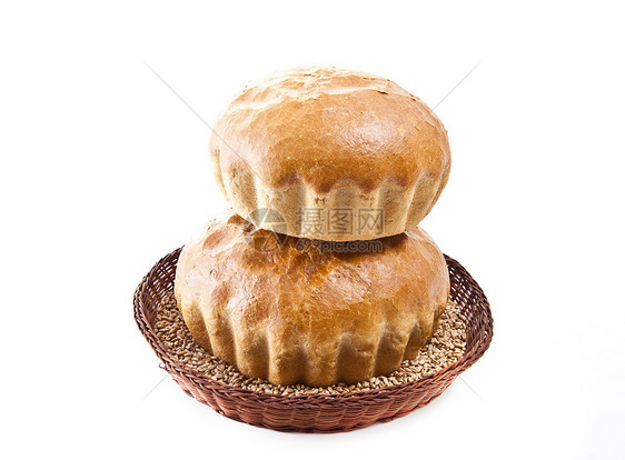 2个新鲜的烤面包卷 一篮子里有粮食图片