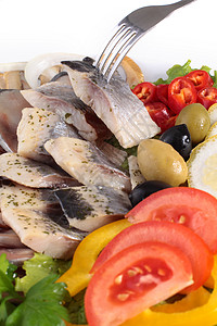 尝着新鲜的嫩绿色植物午餐海鲜鲱鱼小吃用餐鳕鱼面包早餐食物图片