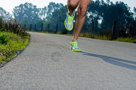 运行中身体运动蓝色慢跑者耐力跑步训练赛跑者国家挑战图片
