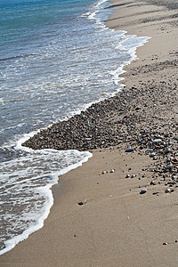 希腊爱琴海沿岸线卵石蓝色活力碰撞海洋海岸线海岸海浪游客泡沫图片