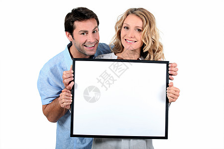 持白板的夫妇夫妻男人女士头发棕色工作室金发丈夫木板白色图片