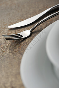 位置设置金属家居行业银器宏观餐具酒店柔焦桌子餐刀图片
