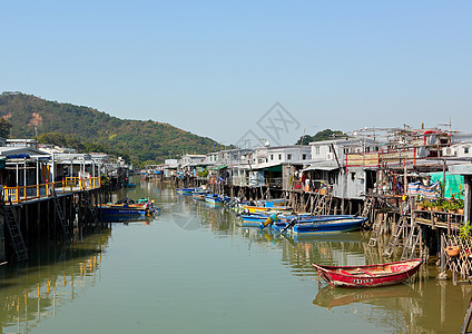 香港Tai O渔业村窝棚风化旅行蓝色场景棚户区房子木头天空村庄图片