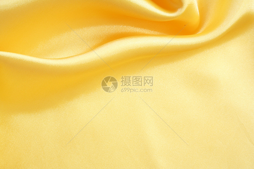 平滑优雅的金金丝绸折痕布料织物纺织品材料曲线黄色投标海浪涟漪图片