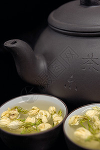 中国茉菊茶壶和杯子茉莉花植物输液茉莉草本植物叶子花瓣图片
