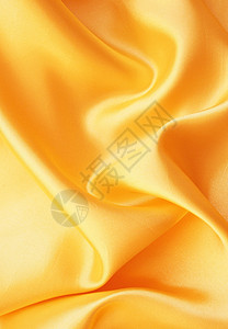 平滑优雅的金色西边作为背景奢华涟漪材料纺织品投标金子丝绸布料折痕黄色图片