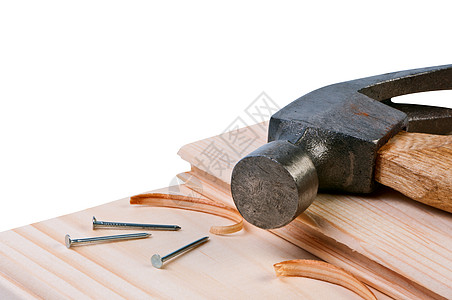 木板上的锤子和钉子 构思建筑和维修图片
