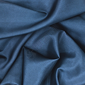 蓝沙丁星海浪材料纺织品褶皱奢华波浪状微光宝蓝色丝绸织物图片