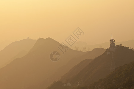 香港山区日落橙子天空丘陵地平线太阳场景射线旅行旅游岩石图片
