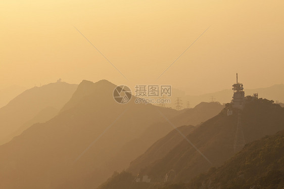 香港山区日落橙子天空丘陵地平线太阳场景射线旅行旅游岩石图片