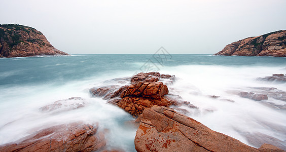 岩石海岸和深水中模糊的水 香港金子蓝色旅行天气日落海洋阳光季节旅游热带图片