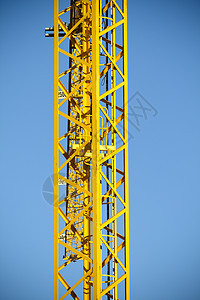 工业区黄色起重机的金属塔工作石膏角落石头住宅窗帘蓝色城市历史性艺术图片
