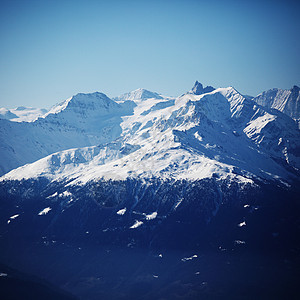 山上有高山旅游运动爬坡冻结活动季节滑雪太阳顶峰风景图片