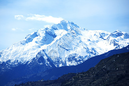 山上有高山暴风雪太阳顶峰阳光冰川风景天空旅行单板季节图片