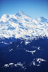 山上有高山顶峰阳光活动运动暴风雪滑雪远足单板太阳冰川图片