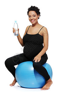 参加运动的孕妇母亲蓝色成人身体女性母性瑜伽肚子保健微笑图片