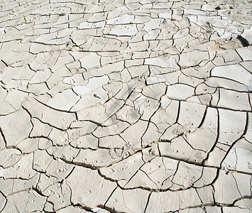 Grunge水泥质料作为背景材料石头灰色破坏裂缝染料白色沙漠石膏风化图片