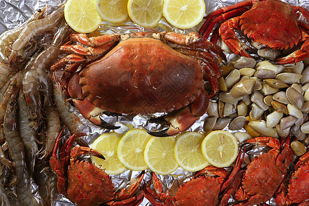 螃蟹告诉虾蛤和柠檬餐厅用餐饮食蛤蜊市场生活动物烹饪午餐海鲜图片