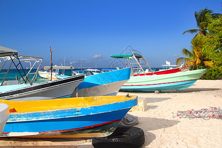 沙滩上富彩多彩的热带船只海岸线沿海海洋地标拉丁旅游天空海岸码头树木图片