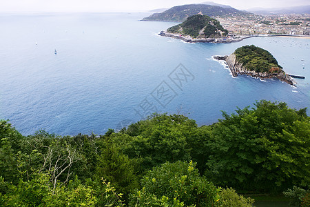 圣塞班斯蒂安城市和海洋的鸟形城市全景海滩航行阳光假期旅行岩石港口国家图片