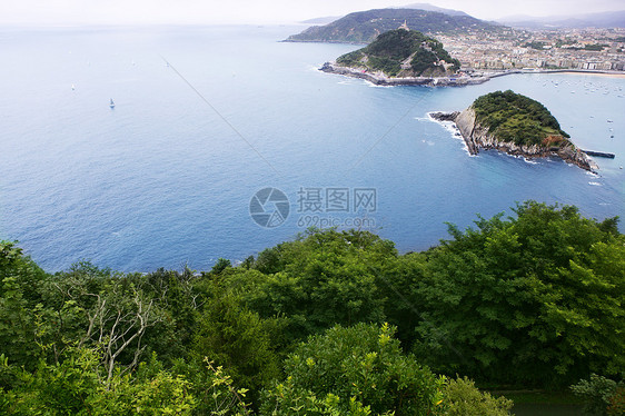 圣塞班斯蒂安城市和海洋的鸟形城市全景海滩航行阳光假期旅行岩石港口国家图片