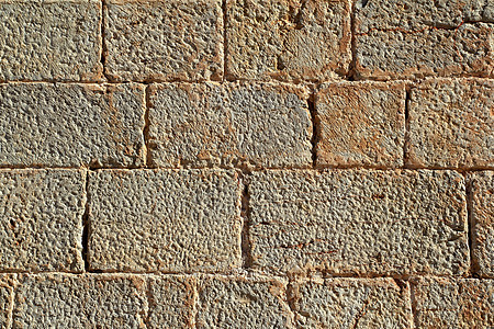 城堡泥石墙雕刻的石头行图案纹理岩石石墙瓦砾房子建筑学建筑师墙纸水泥大理石警卫图片