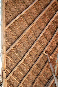 墨西哥的木屋屋顶小木屋详细细节光束棕榈缝纫小屋房子植物手工热带木头太阳图片