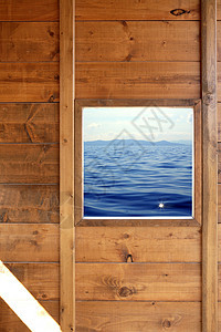 木制室窗口海景视图蓝色展示住宅橡木建筑学正方形海洋日落房子财产图片