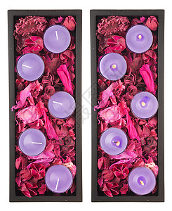 Spa 设置香气花朵火焰蜡烛药品木头疗法芳香紫色黑色背景图片