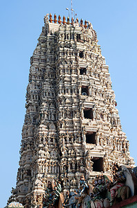 印度教寺庙建筑学遗产雕刻上帝风化石头雕像文化蓝色游客图片