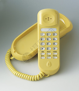 黄电话听筒拨号风格背景纯色塑料复兴电缆颜色黄色图片