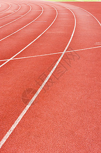 正在运行轨道场地竞赛锻炼运动员曲线竞争体育场车道运动挑战背景图片
