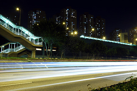 夜间在香港高速公路上进行交通路面街道地标人行道城市蓝色行人天桥建筑运输图片