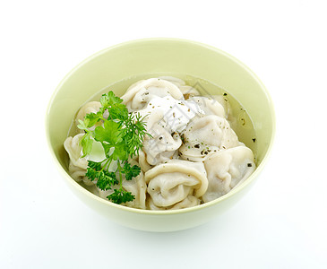 含酸奶油和绿菜的肉蛋白质美食午餐国家香料水饺厨房猪肉牛肉饺子面团图片