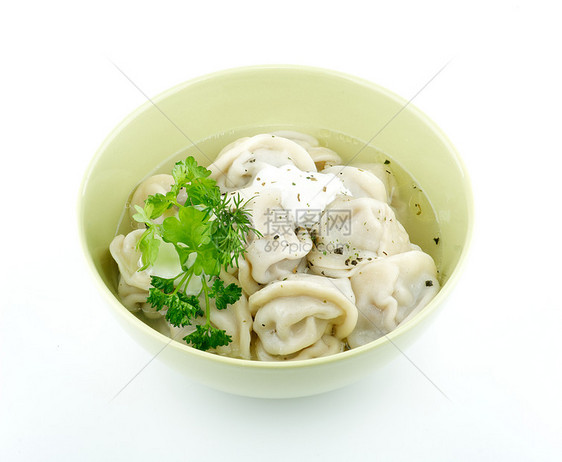 含酸奶油和绿菜的肉蛋白质美食午餐国家香料水饺厨房猪肉牛肉饺子面团图片